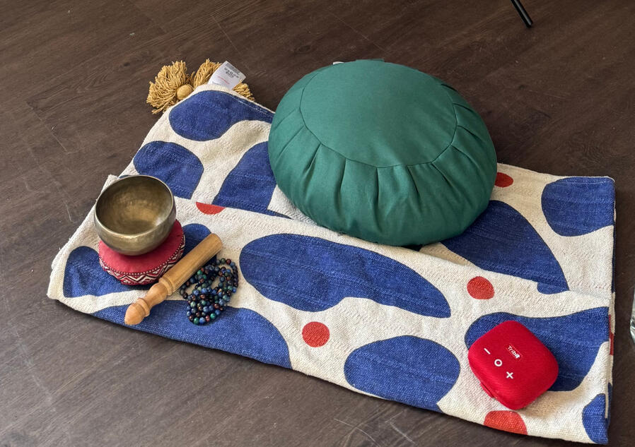 Image from a past event A BabblingZen Chakra Banner with a Zafu set up for meditation